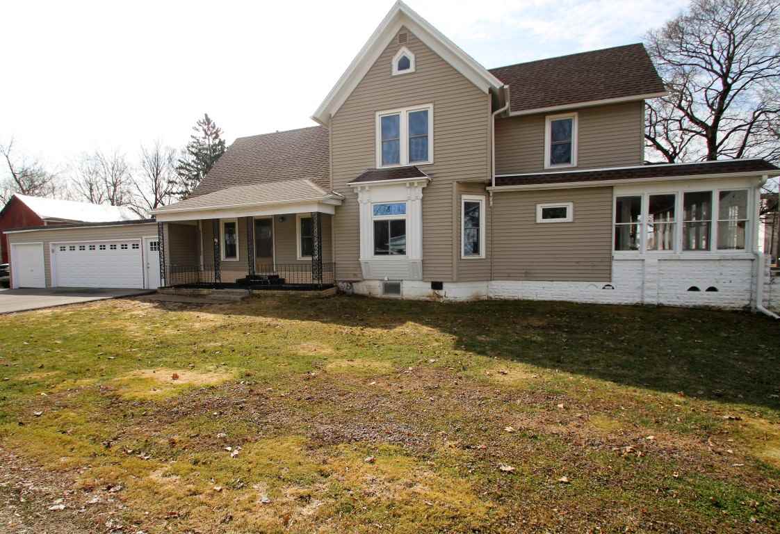 145 4th Street Capron, IL 61012 - Photo 1 of 24 a front view of a house with a yard
