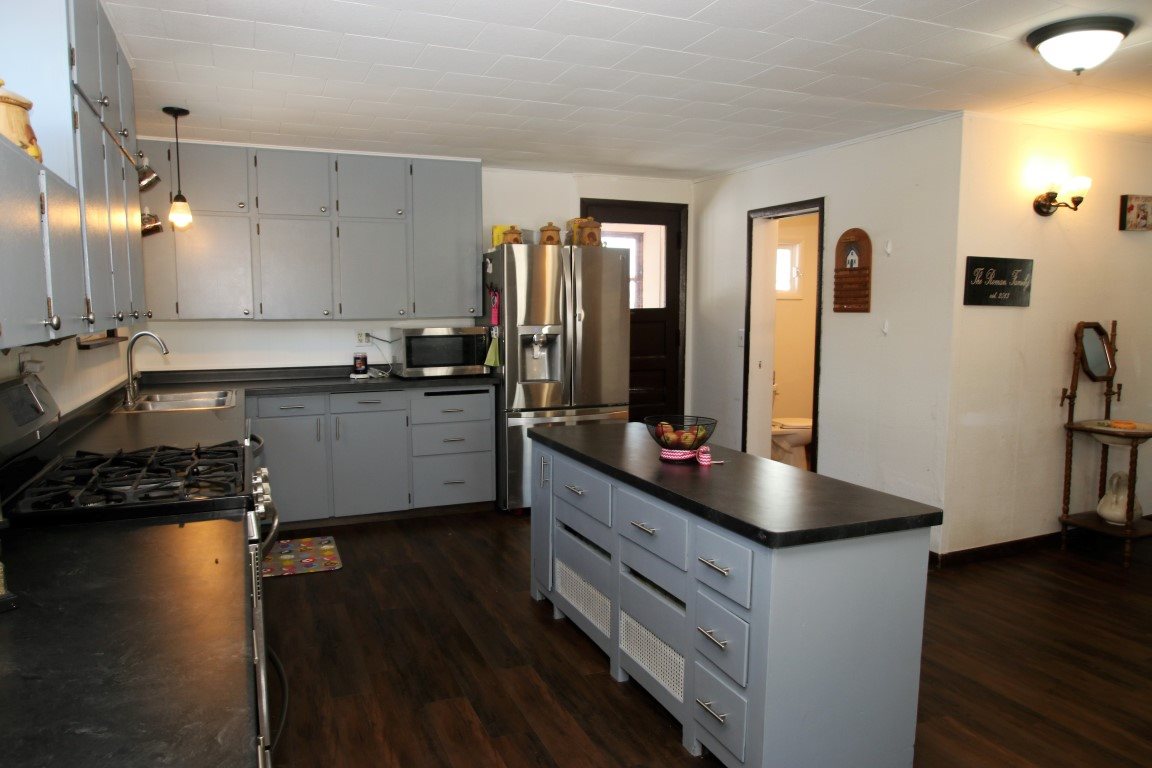 145 4th Street Capron, IL 61012 - Photo 13 of 24 a kitchen with a sink appliances and cabinets