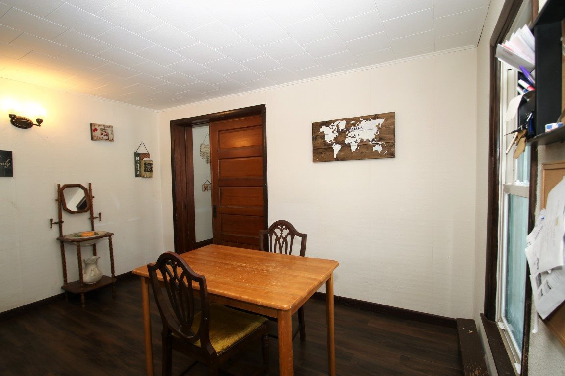 145 4th Street Capron, IL 61012 - Photo 15 of 24 a view of a room that has a table and a chair in it