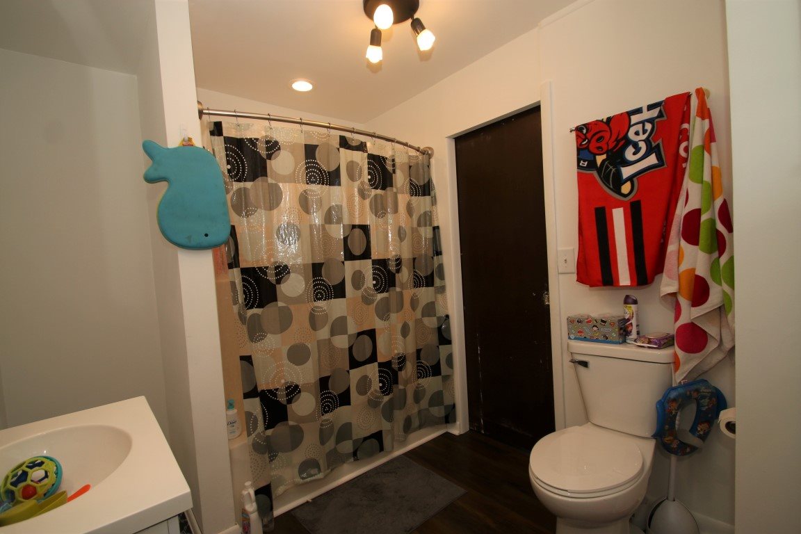 145 4th Street Capron, IL 61012 - Photo 16 of 24 a bathroom with a toilet and a shower