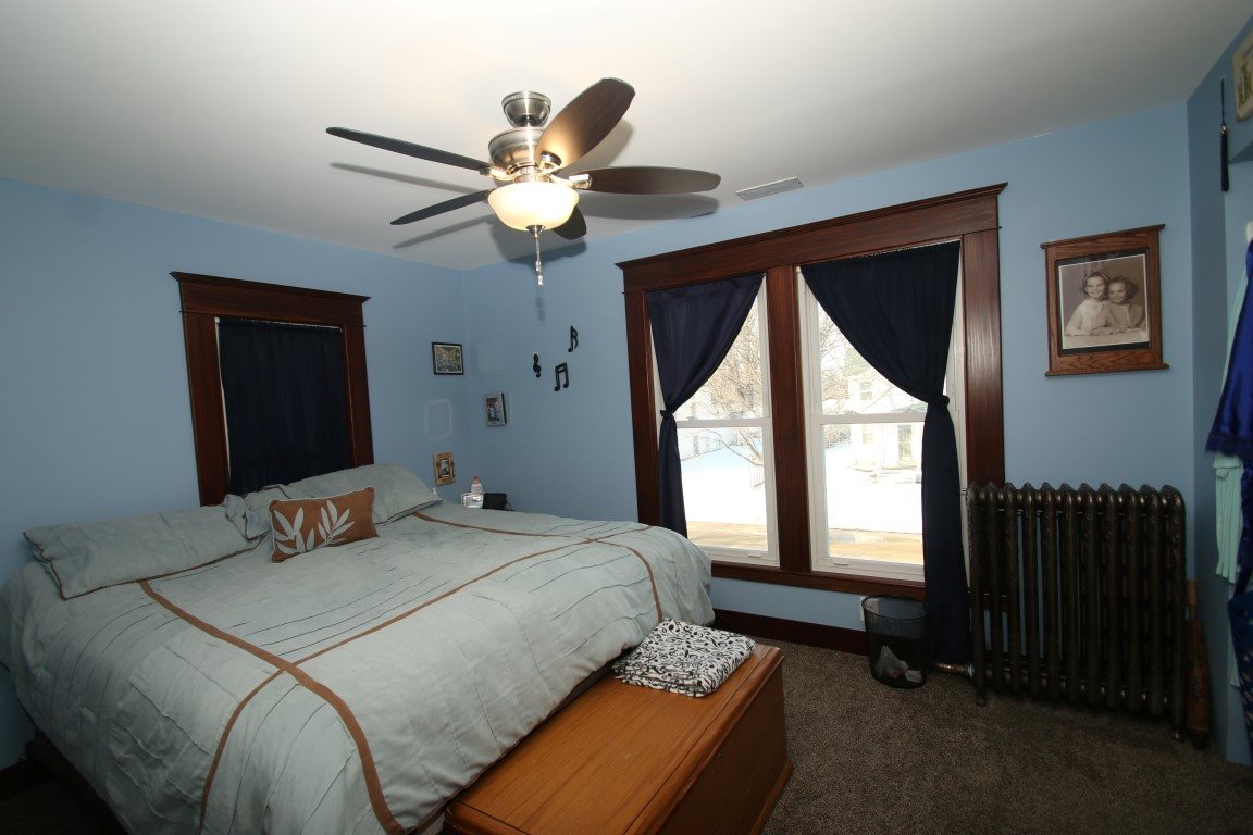 145 4th Street Capron, IL 61012 - Photo 17 of 24 a bedroom with a bed and a window