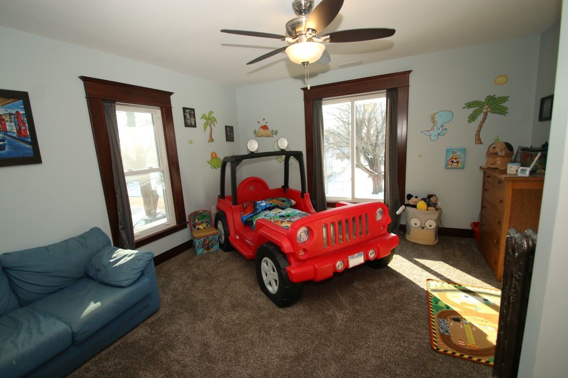 145 4th Street Capron, IL 61012 - Photo 19 of 24 a bed room with a bed and a window