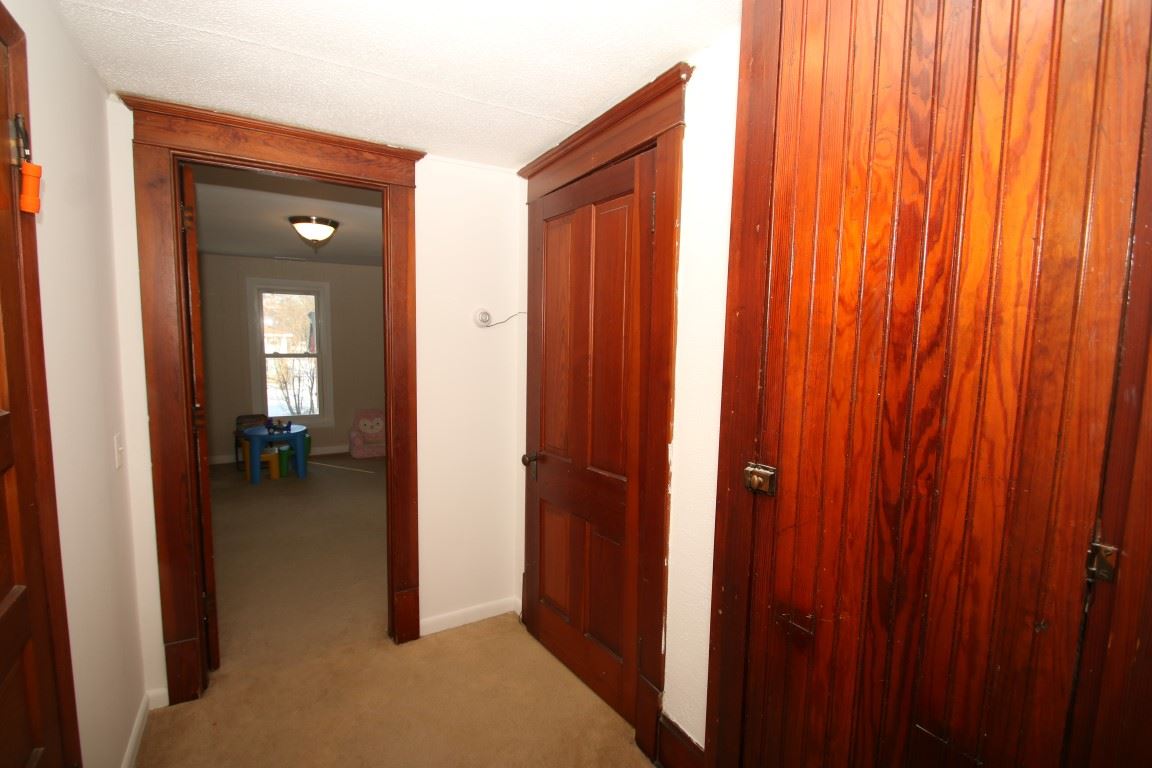 145 4th Street Capron, IL 61012 - Photo 20 of 24 a view of a livingroom and a hallway