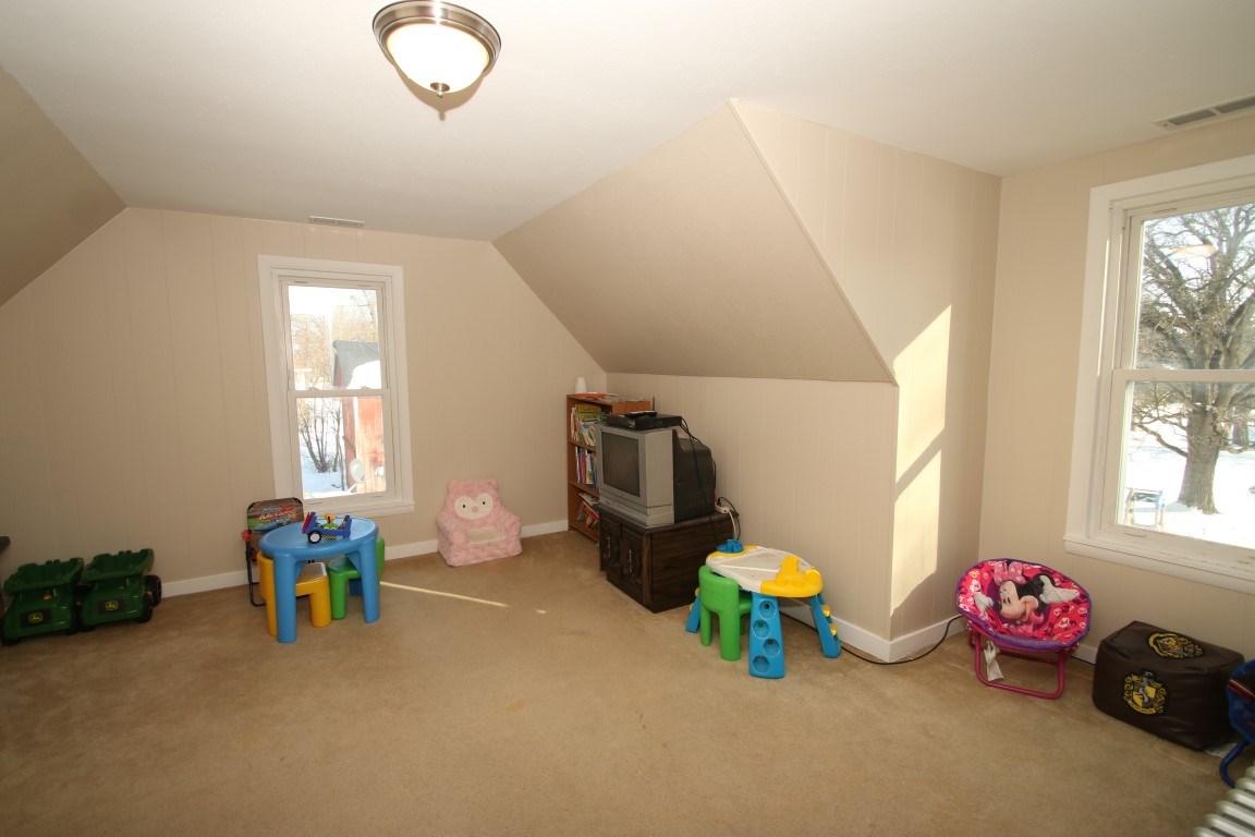145 4th Street Capron, IL 61012 - Photo 22 of 24 a room with furniture and a window