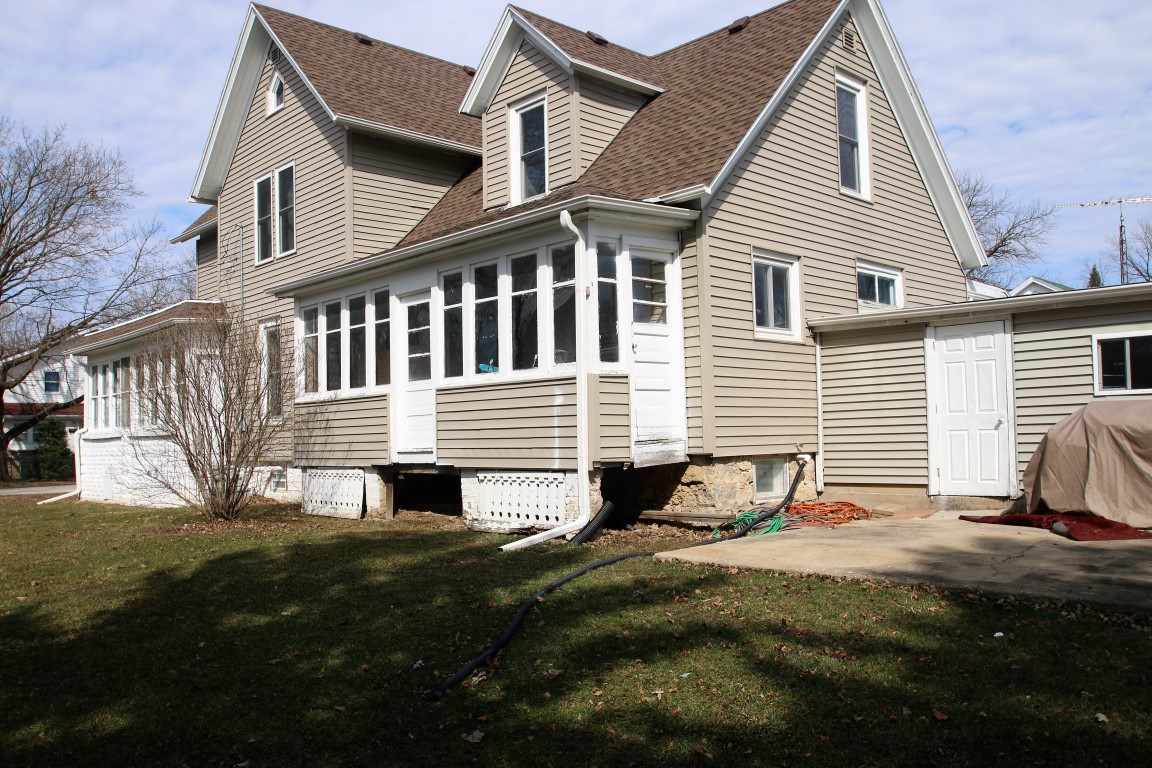 145 4th Street Capron, IL 61012 - Photo 24 of 24 a view of a house with a yard