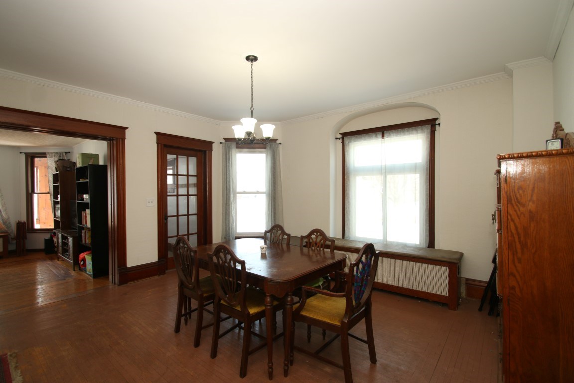 145 4th Street Capron, IL 61012 - Photo 9 of 24 a view of a dining room with furniture and window