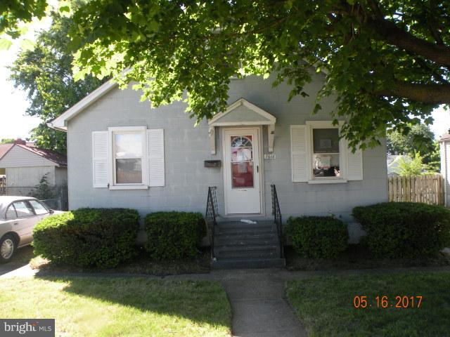 7616 Gum Road Baltimore, MD 21222 - Photo 1 of 5 a front view of a house with a yard