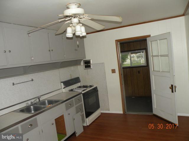 7616 Gum Road Baltimore, MD 21222 - Photo 4 of 5 a view of a kitchen with a sink