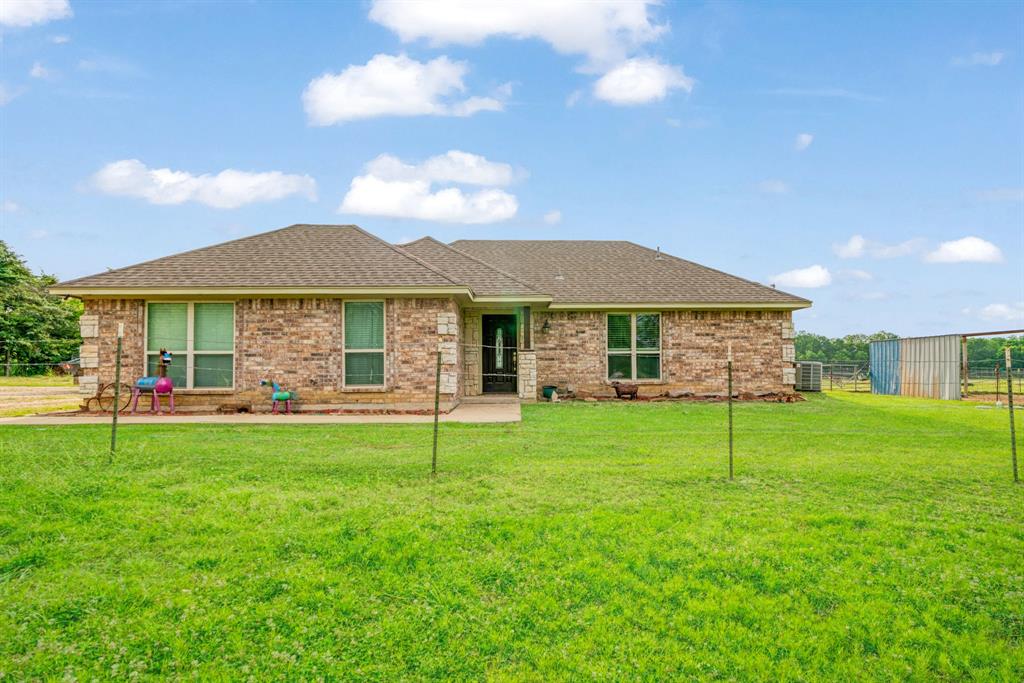 1890 County Road Sumner, TX 75486 - Photo 1 of 20 a house view with a garden space
