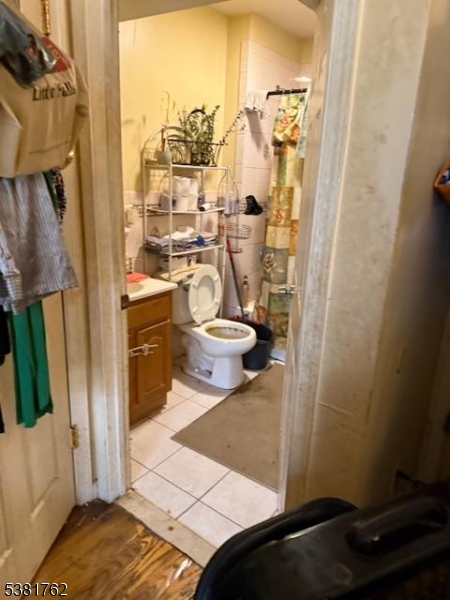 12 Amity Street, Unit 2 Paterson, NJ 07522 - Photo 12 of 14 a bathroom with a sink and a mirror