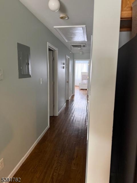 12 Amity Street, Unit 2 Paterson, NJ 07522 - Photo 3 of 14 a view of a hallway with wooden floor