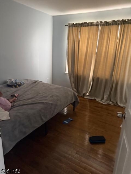 12 Amity Street, Unit 2 Paterson, NJ 07522 - Photo 4 of 14 a bedroom with a bed and a window