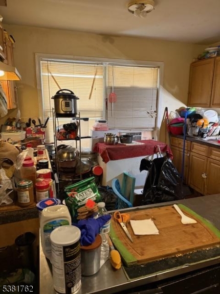 12 Amity Street, Unit 2 Paterson, NJ 07522 - Photo 7 of 14 a room with furniture and a wooden floor