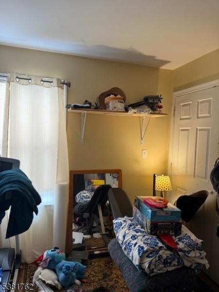 12 Amity Street, Unit 2 Paterson, NJ 07522 - Photo 9 of 14 a bedroom with a bed and a closet