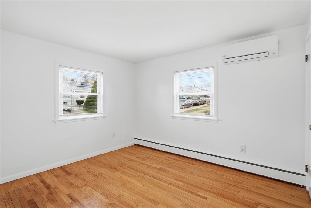 126 Summer Street Boston, MA 02136 - Photo 12 of 28 a view of a big room with wooden floor and windows