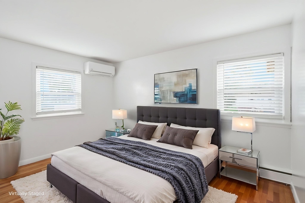 126 Summer Street Boston, MA 02136 - Photo 14 of 28 a bedroom with a bed and a window