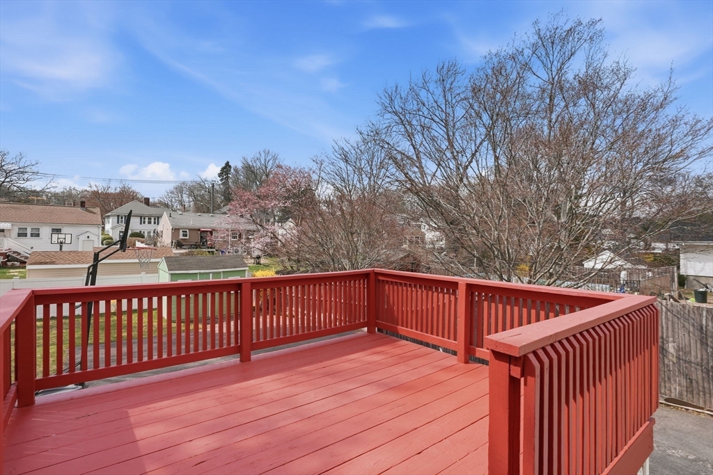 126 Summer Street Boston, MA 02136 - Photo 23 of 28 a view of balcony with wooden floor and fence