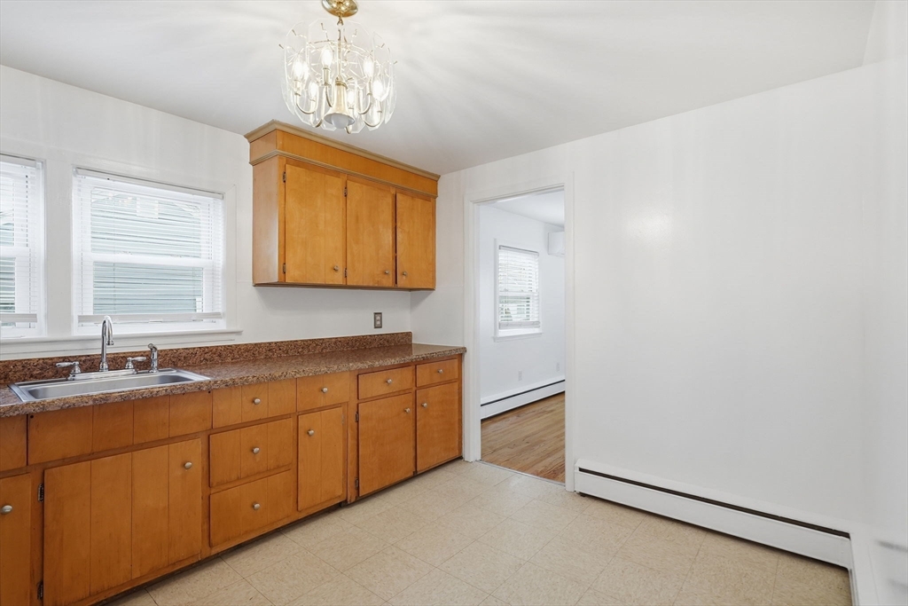 126 Summer Street Boston, MA 02136 - Photo 9 of 28 a bathroom with a sink mirror and a bathtub