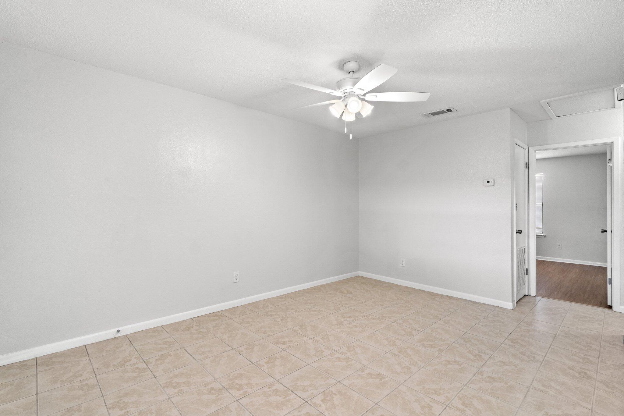 248 4 Mile Road, Unit F Freeport, FL 32439 - Photo 10 of 17 wooden floor in an empty room