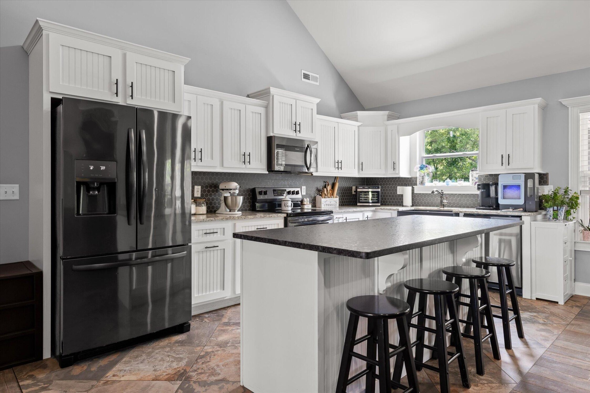72 Farm View Circle Rock Spring, GA 30739 - Photo 11 of 41 a kitchen with stainless steel appliances granite countertop a refrigerator a sink a stove a dining table and chairs