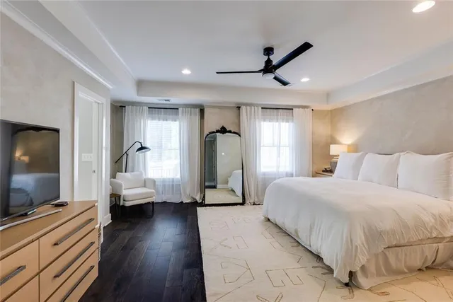 a bedroom with a bed and a mirror