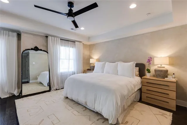 a bedroom with a bed and a couch