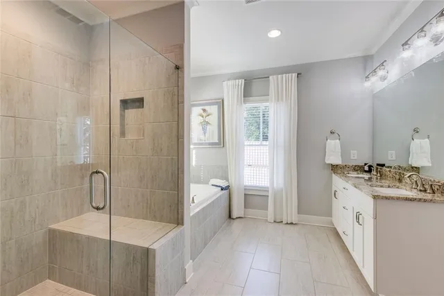 a bathroom with a bathtub and a shower