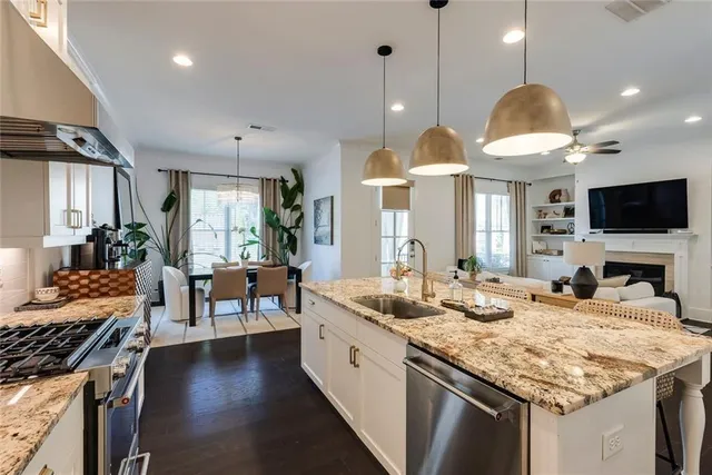 a kitchen with center island table and chairs in it