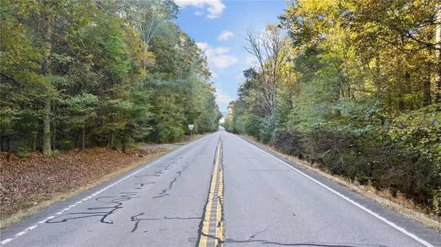 a aerial view of a house with a lake