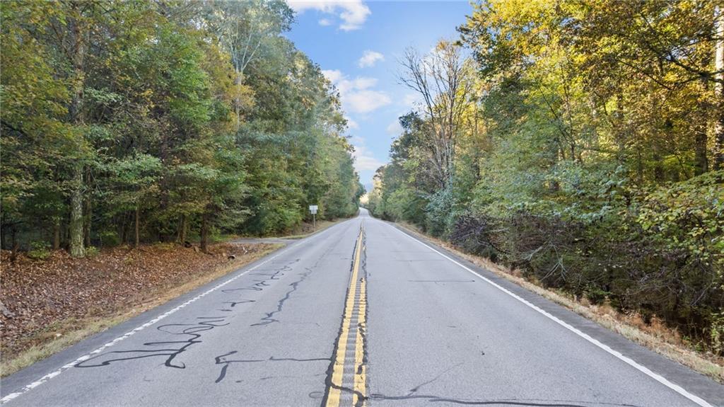 0 Mill Road Cave Spring, GA 30124 - Photo 2 of 6 a view of a dry yard with wooden fence