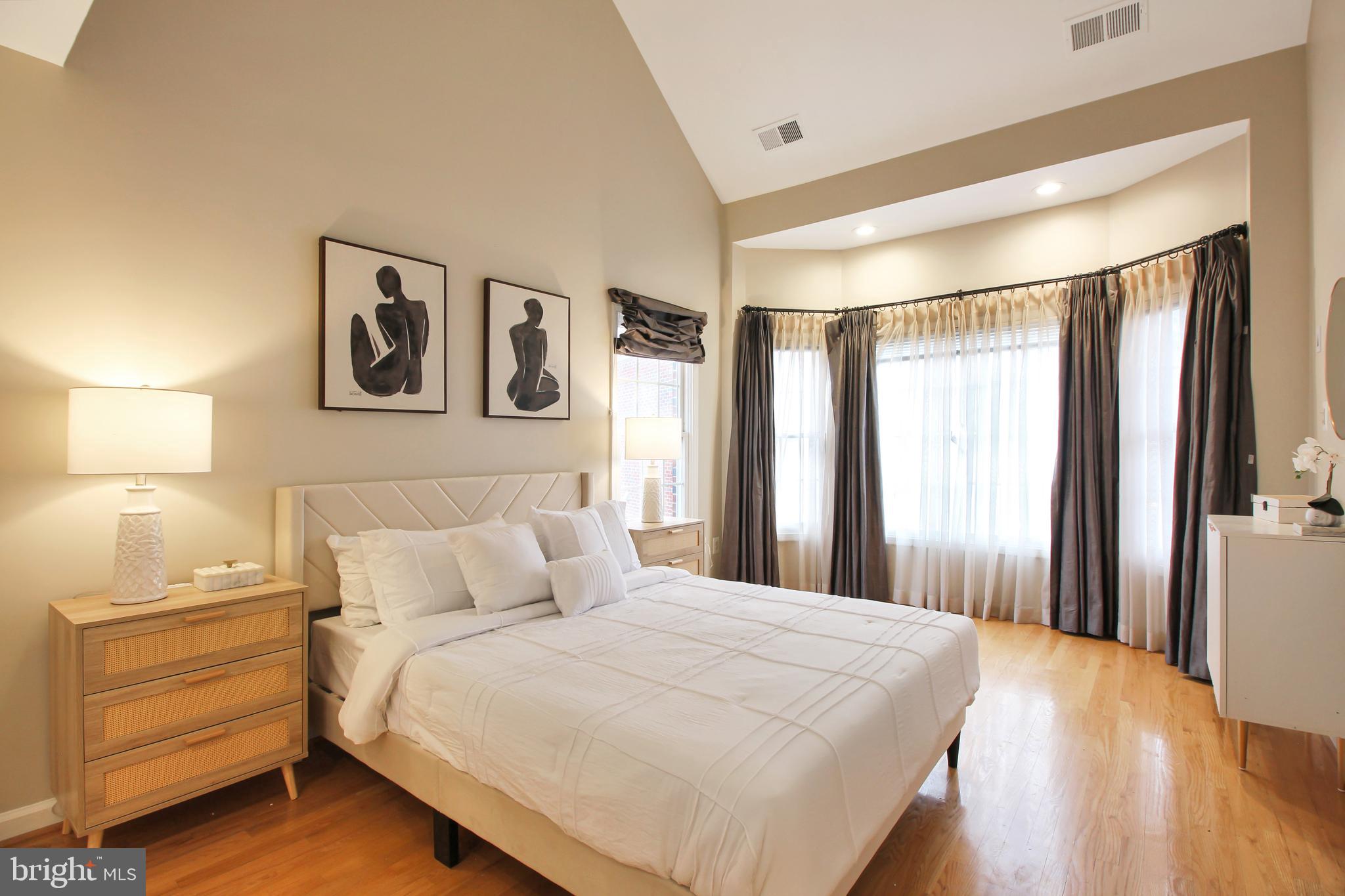 1227 Fidler Lane Silver Spring, MD 20910 - Photo 19 of 33 a bedroom with a bed and a window