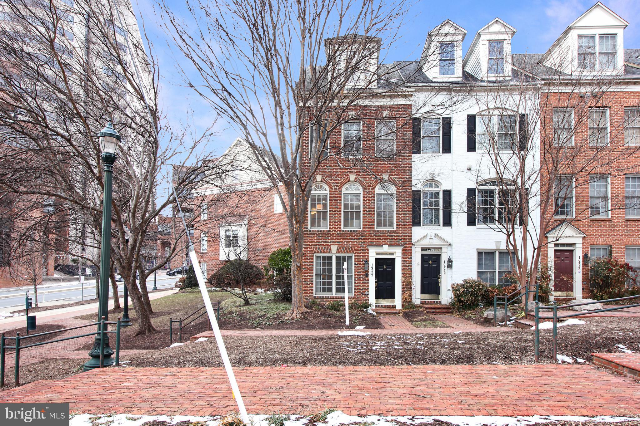 1227 Fidler Lane Silver Spring, MD 20910 - Photo 2 of 33 a front view of a building with a yard