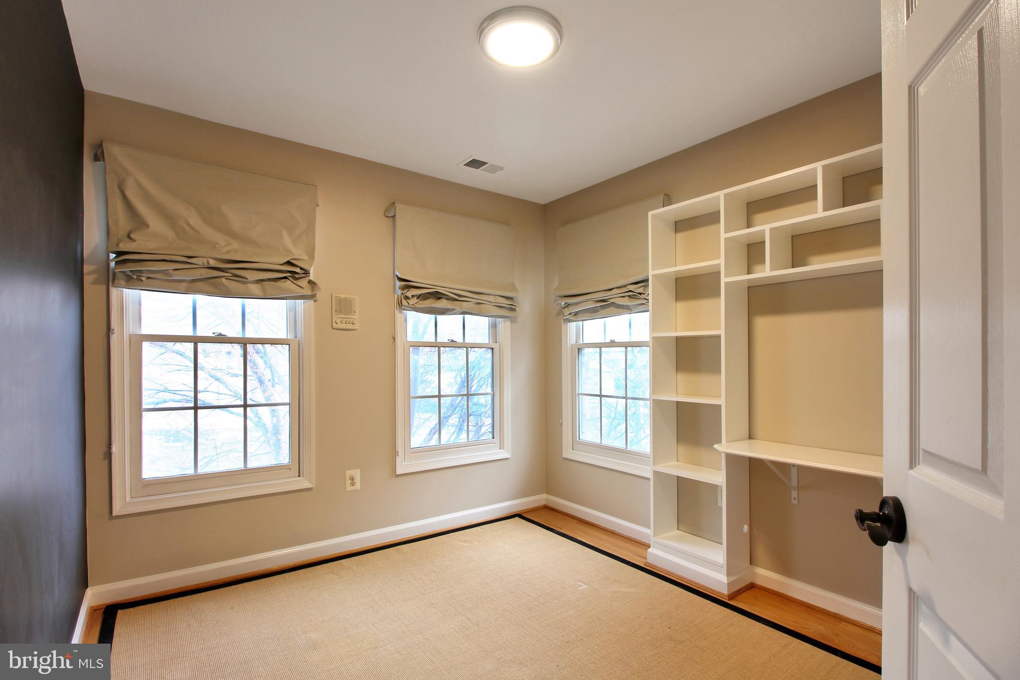 1227 Fidler Lane Silver Spring, MD 20910 - Photo 25 of 33 a view of an empty room with a window