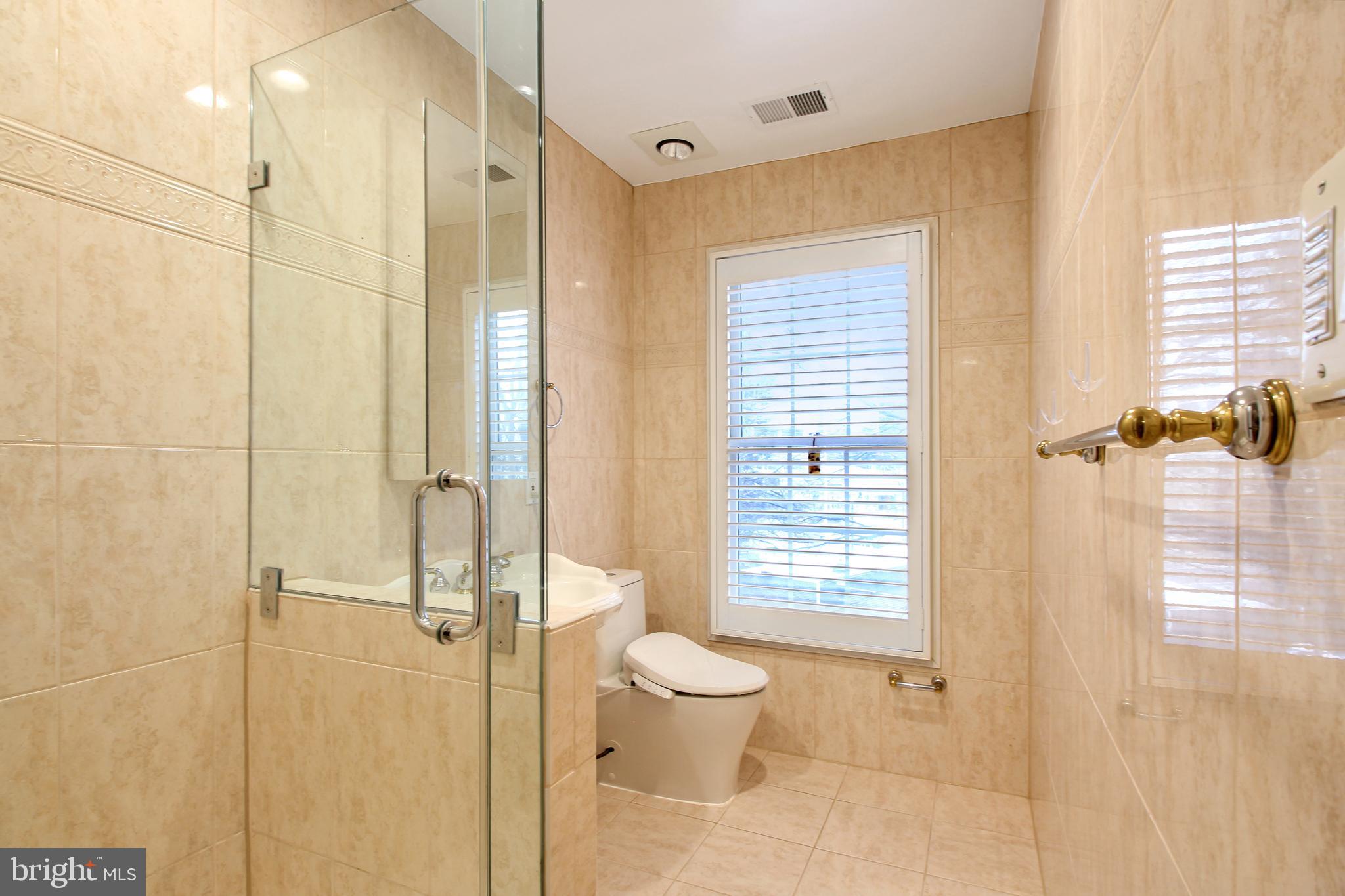 1227 Fidler Lane Silver Spring, MD 20910 - Photo 26 of 33 a bathroom with a toilet and a shower