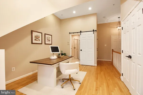 a workspace with furniture and wooden floor