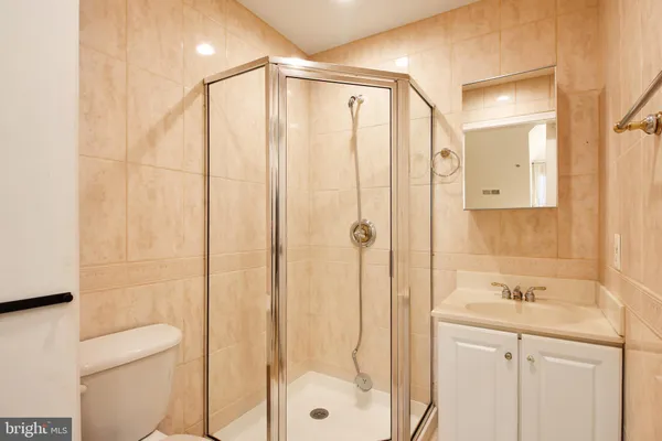 a bathroom with a shower and a sink
