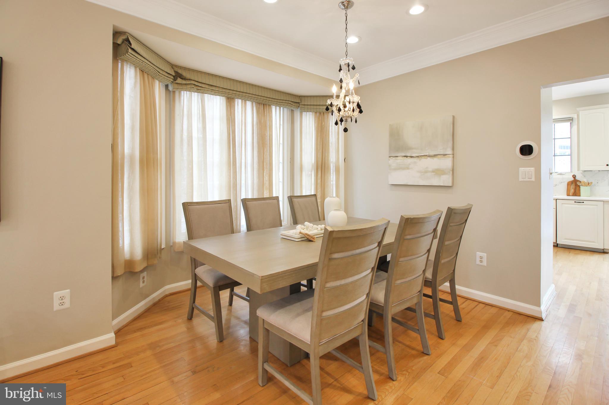 1227 Fidler Lane Silver Spring, MD 20910 - Photo 9 of 33 a view of a dining room with furniture window and wooden floor