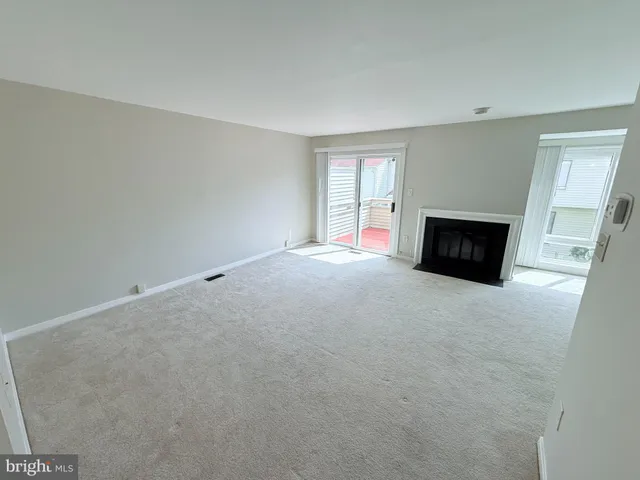 an empty room with a fireplace