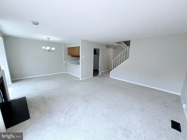 a view of a kitchen with a sink and cabinet