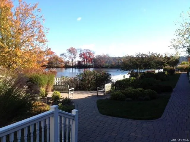 a view of a lake with a house in the background