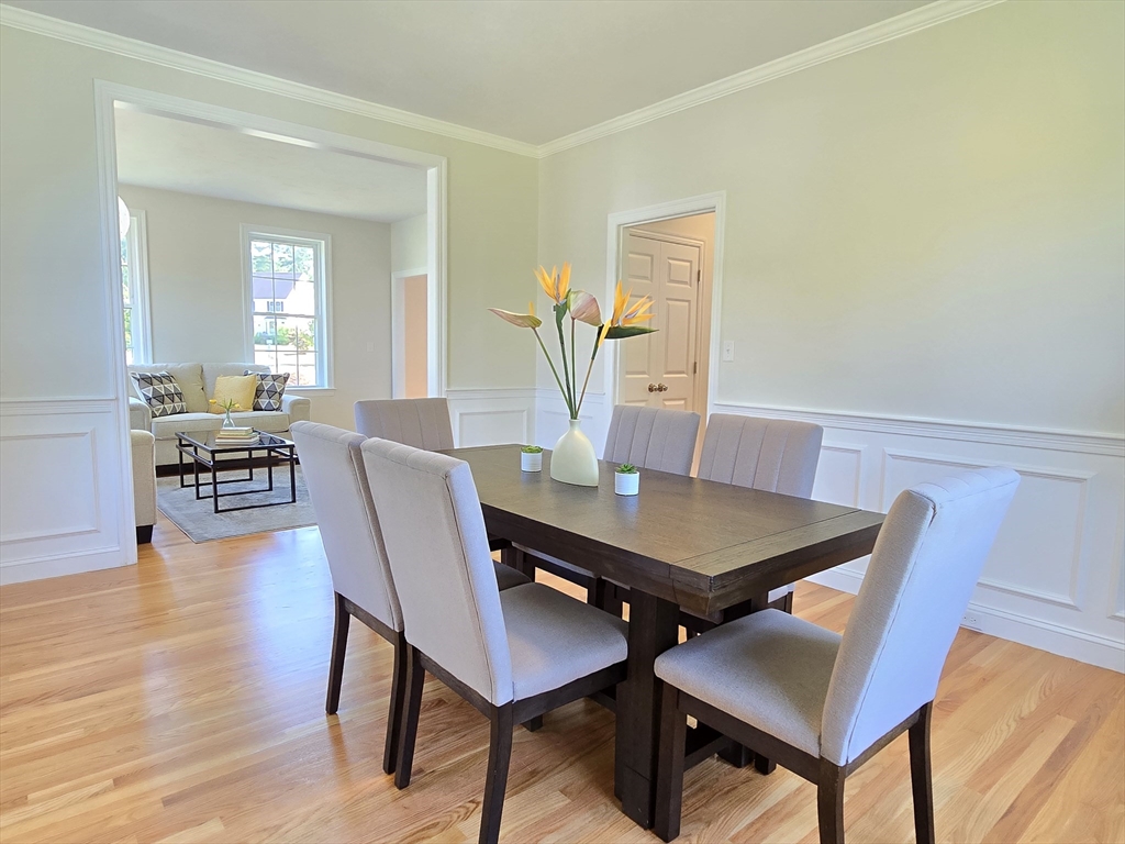 3 Willow Road Ashland, MA 01721 - Photo 11 of 41 a view of a dining room with furniture and wooden floor