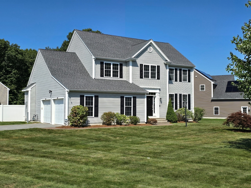 3 Willow Road Ashland, MA 01721 - Photo 2 of 41 a front view of a house with a yard