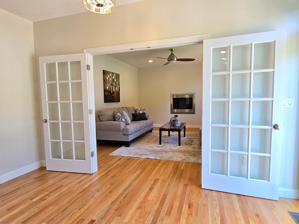 3 Willow Road Ashland, MA 01721 - Photo 24 of 41 a living room with furniture and a wooden floor