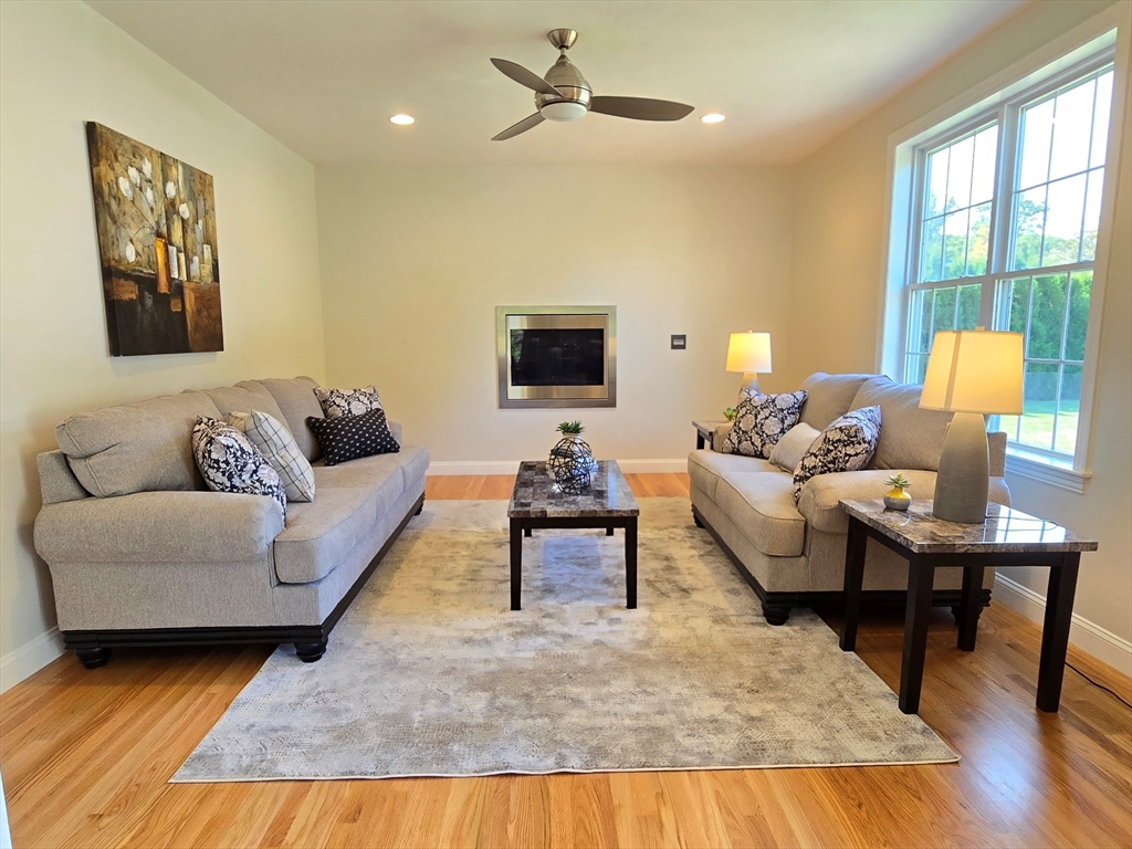 3 Willow Road Ashland, MA 01721 - Photo 25 of 41 a living room with furniture fireplace and a table