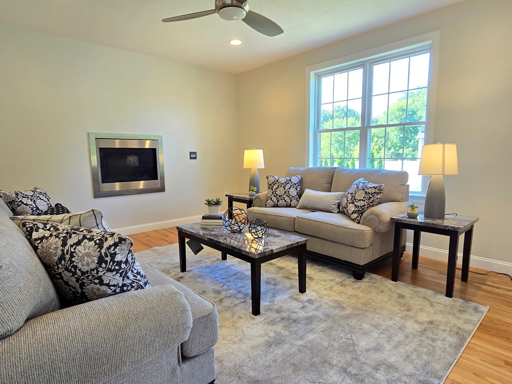 3 Willow Road Ashland, MA 01721 - Photo 26 of 41 a living room with furniture and a lamp