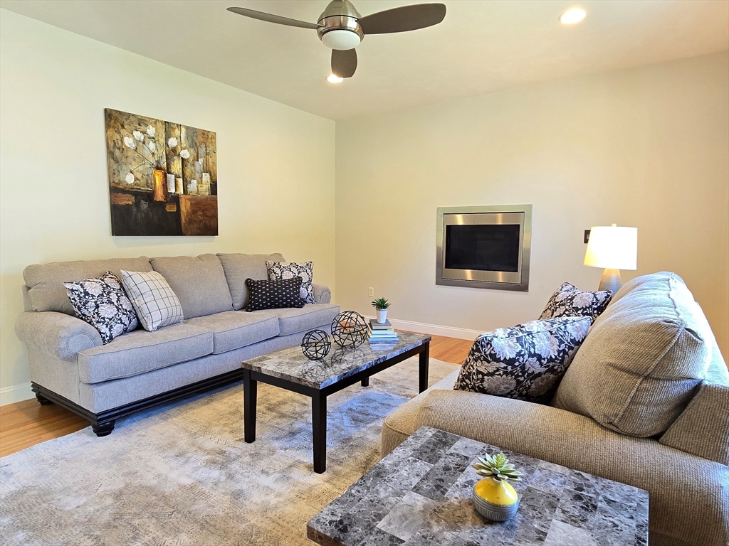3 Willow Road Ashland, MA 01721 - Photo 29 of 41 a living room with furniture and a flat screen tv