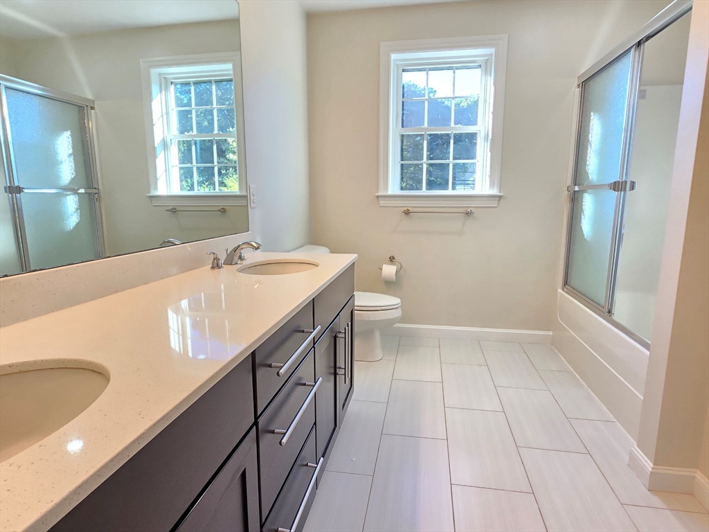 3 Willow Road Ashland, MA 01721 - Photo 33 of 41 a bathroom with a sink a vanity and a bathtub