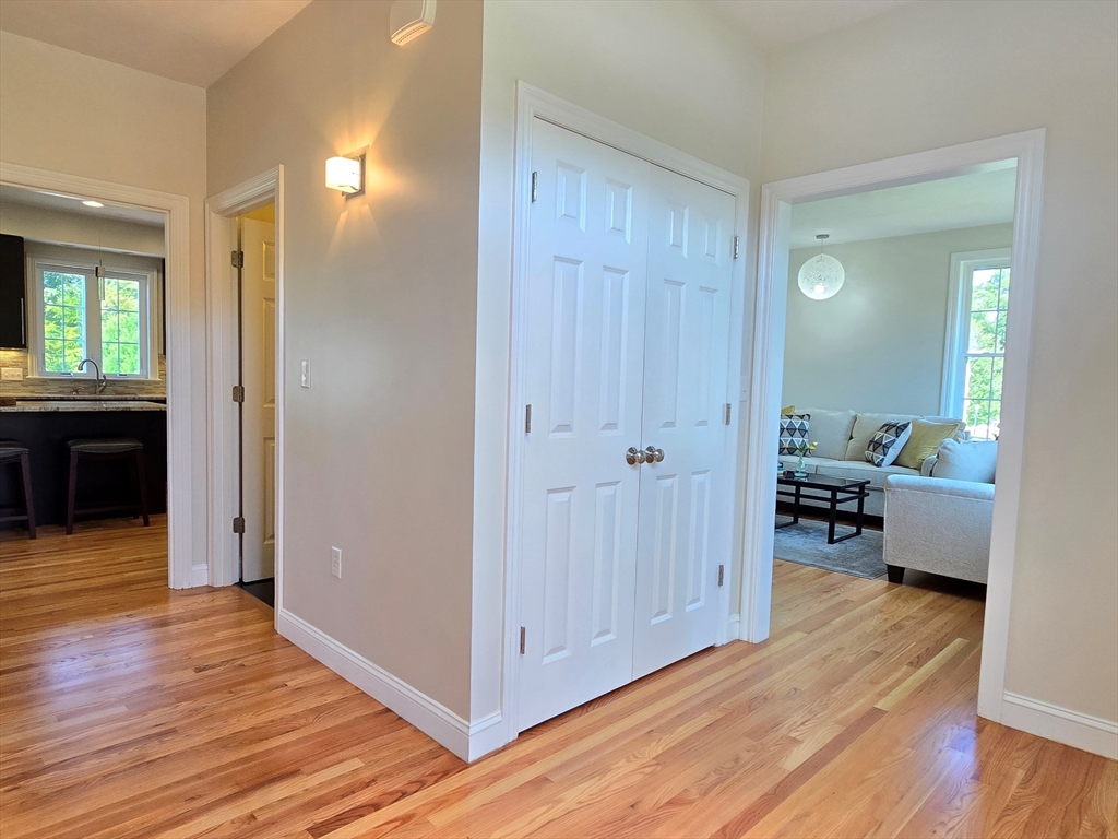 3 Willow Road Ashland, MA 01721 - Photo 6 of 41 a view of a livingroom with wooden floor and a bedroom