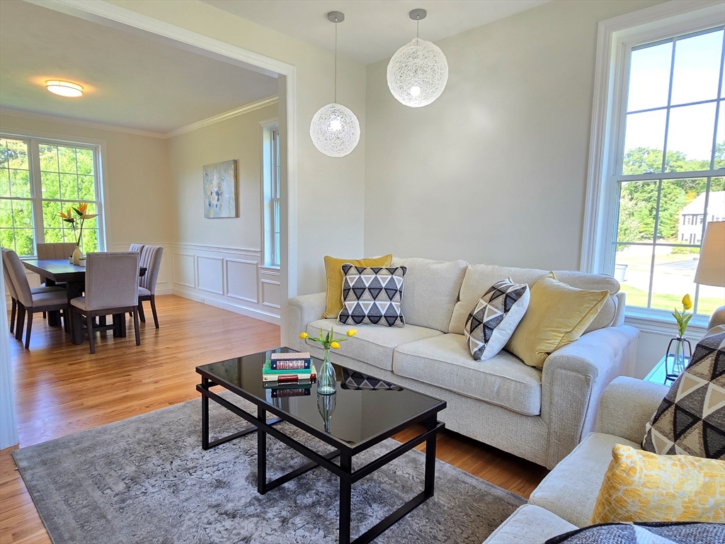 3 Willow Road Ashland, MA 01721 - Photo 10 of 41 a living room with furniture a rug a lamp and a large window