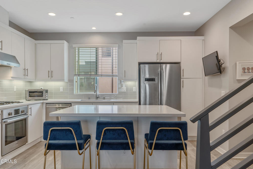 1553 Verbena Way Los Angeles, CA 90041 - Photo 12 of 31 a kitchen with stainless steel appliances a sink and cabinets